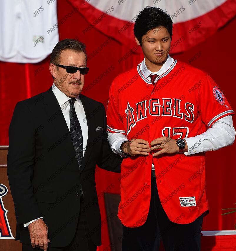Dec 9, 2017; Anaheim, CA, USA; Los Angeles Angels player Shohei Ohtani (17) is introduced as the newest member of the Angels organization by owner Arte Moreno at Anaheim Stadium of Anaheim. Mandatory Credit: Jayne Kamin-Oncea-USA TODAY Sports MLB: Los Angeles Angels-Press Conference 