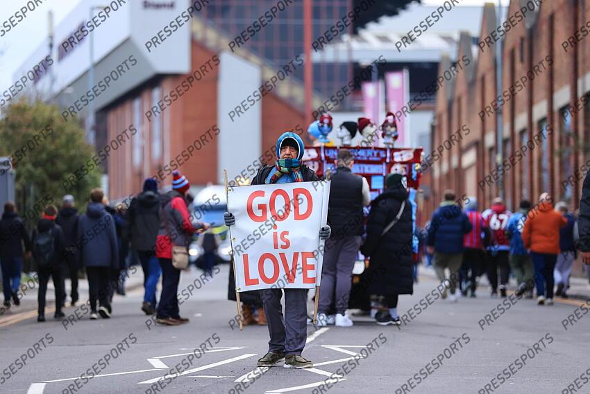 11th February 2024 - Premier League - Aston Villa v Manchester United - A man on the street holds a sign reading 'God Is Love' before the match - Photo: Simon Stacpoole / Offside. ASTON VILLA-MANCHESTER UNITED (1-2) 