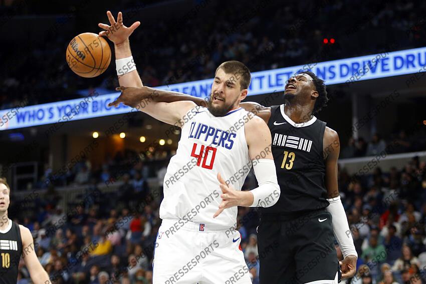 Feb 23, 2024; Memphis, Tennessee, USA; Los Angeles Clippers center Ivica Zubac (40) and Memphis Grizzlies forward-center Jaren Jackson Jr. (13) battle for a rebound during the second half at FedExForum. Mandatory Credit: Petre Thomas-USA TODAY Sports NBA: Los Angeles Clippers at Memphis Grizzlies 