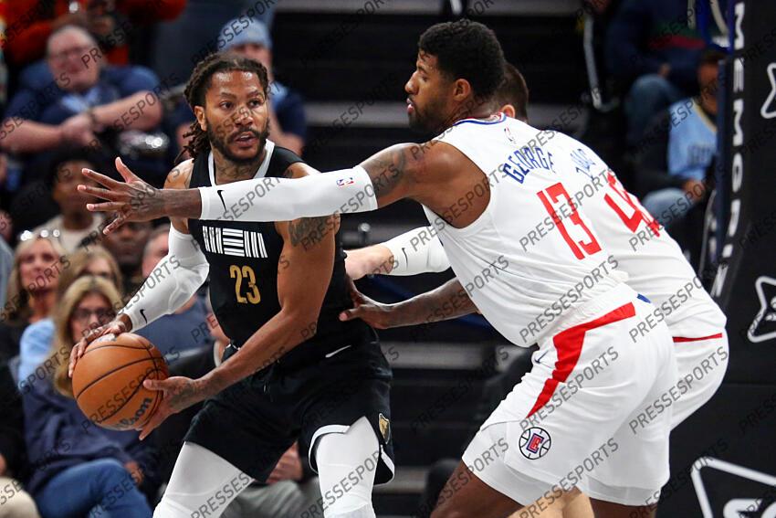 Feb 23, 2024; Memphis, Tennessee, USA; Memphis Grizzlies guard Derrick Rose (23) handles the ball as Los Angeles Clippers forward Paul George (13) defends during the second half at FedExForum. Mandatory Credit: Petre Thomas-USA TODAY Sports NBA: Los Angeles Clippers at Memphis Grizzlies 
