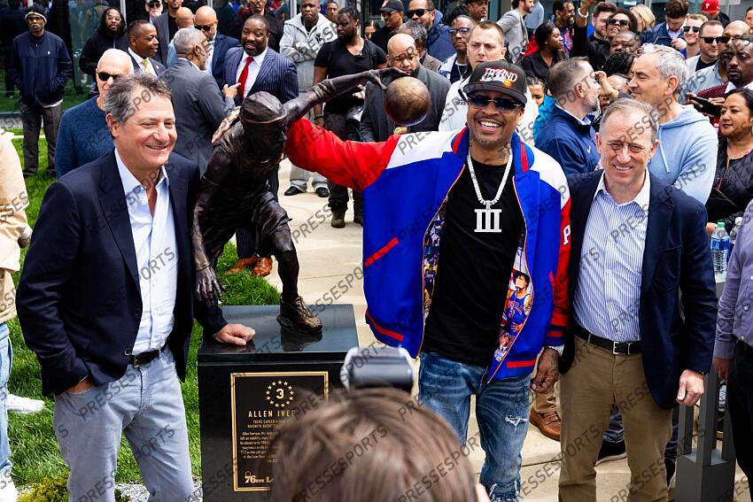 Apr 12, 2024; Camden, NJ, USA; Philadelphia 76ers great Allen Iverson (M) stands alongside managing partners David Blitzer (L) and Josh Harris (R) during the unveiling of the statue honoring him in a ceremony at the Philadelphia 76ers Training Complex. Mandatory Credit: Bill Streicher-USA TODAY Sports NBA: Philadelphia 76ers-Iverson Statue Ceremony 