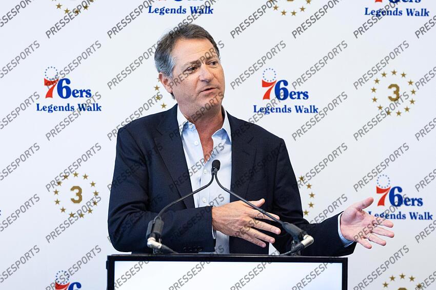 Apr 12, 2024; Camden, NJ, USA; Philadelphia 76ers Managing Partner David Blitzer speaks at the podium during the presentation of a statue honoring Allen Iverson (not pictured) in a ceremony at Penn Medicine Philadelphia 76ers Training Complex. Mandatory Credit: Bill Streicher-USA TODAY Sports NBA: Philadelphia 76ers-Iverson Statue Ceremony 