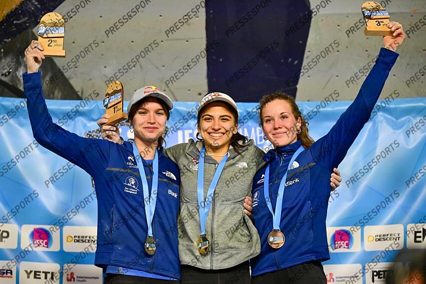 May 5, 2024; Salt Lake City, UTAH, USA; Natalia Grossman of the United States of America takes gold (center), Oriane Bertone of France takes silver (left), and Naïle Meignan of France takes bronze (right) in the IFSC World Cup women's boulder final at the USA Climbing National Training Center. Mandatory Credit: Christopher Creveling-USA TODAY Sports Climbing: IFSC Climbing World Cup 
