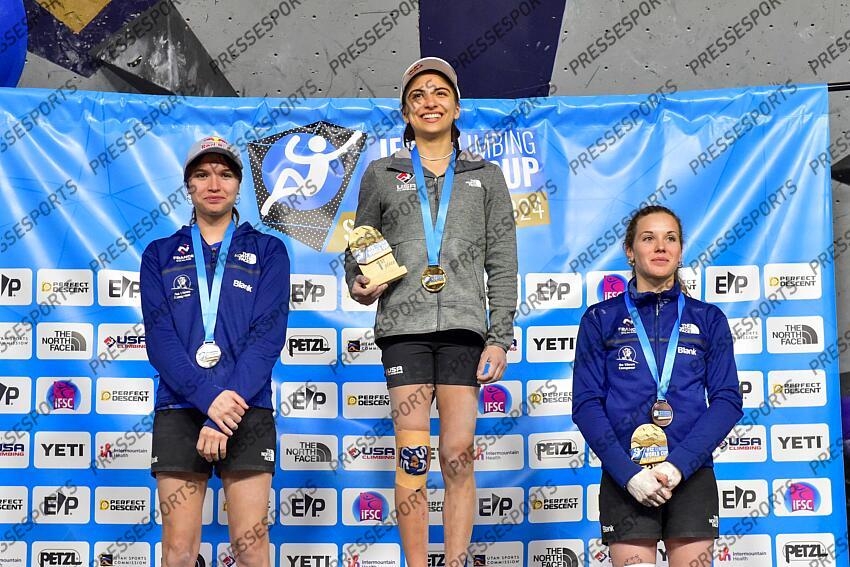 May 5, 2024; Salt Lake City, UTAH, USA; Natalia Grossman of the United States of America takes gold (center), Oriane Bertone of France takes silver (left), and Naïle Meignan of France takes bronze (right) in the IFSC World Cup women's boulder final at the USA Climbing National Training Center. Mandatory Credit: Christopher Creveling-USA TODAY Sports Climbing: IFSC Climbing World Cup 