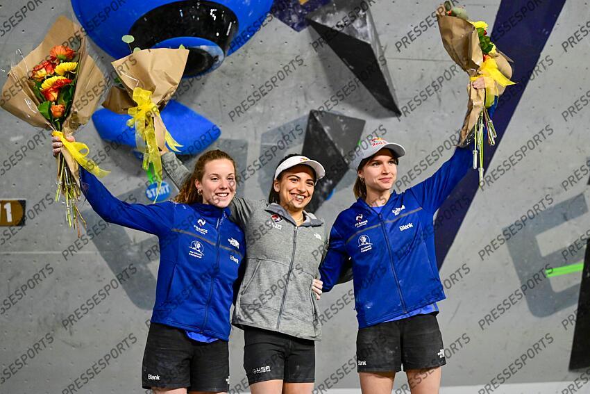 May 5, 2024; Salt Lake City, UTAH, USA; Natalia Grossman of the United States of America (center) takes gold, Naïle Meignan of France (left) takes bronze, and Oriane Bertone of France (right) takes silver in the IFSC World Cup women's boulder final at the USA Climbing National Training Center. Mandatory Credit: Christopher Creveling-USA TODAY Sports Climbing: IFSC Climbing World Cup 