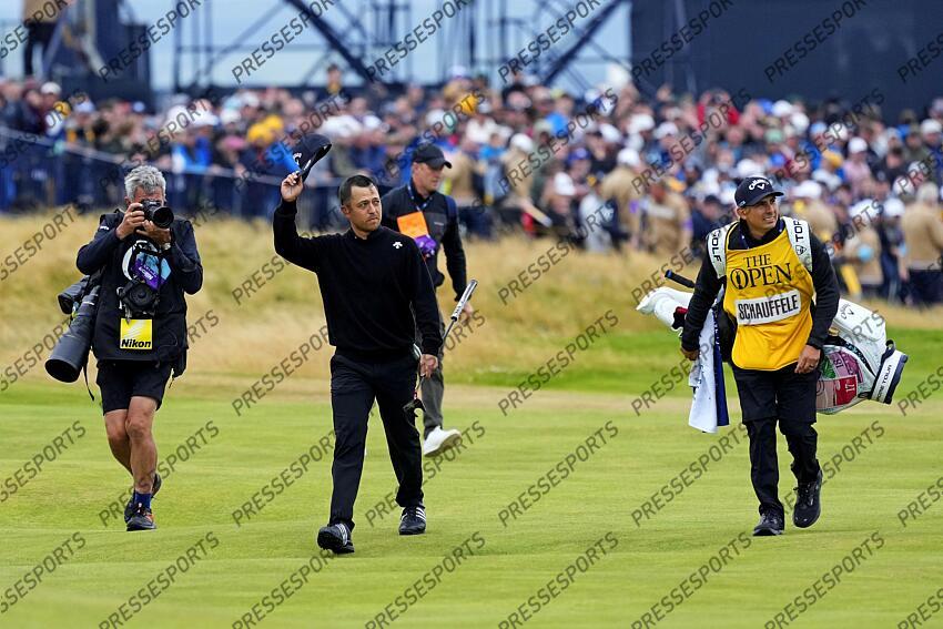Jul 21, 2024; Ayrshire, SCT; Xander Schauffele waves to the gallery as he walks to the 18th green during the final round of the Open Championship golf tournament at Royal Troon. Mandatory Credit: Jack Gruber-USA TODAY Sports PGA: The Open Championship - Final Round 