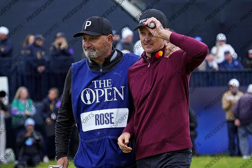 Jul 21, 2024; Ayrshire, SCT; Justin Rose and his caddie Mark 'Fooch' Fulcher walk off the 18th green during the final round of the Open Championship golf tournament at Royal Troon. Mandatory Credit: Jack Gruber-USA TODAY Sports PGA: The Open Championship - Final Round 