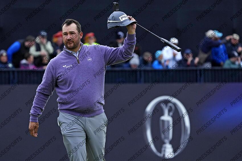 Jul 21, 2024; Ayrshire, SCT; Thriston Lawrence acknowledges the gallery on the 18th green during the final round of the Open Championship golf tournament at Royal Troon. Mandatory Credit: Jack Gruber-USA TODAY Sports PGA: The Open Championship - Final Round 