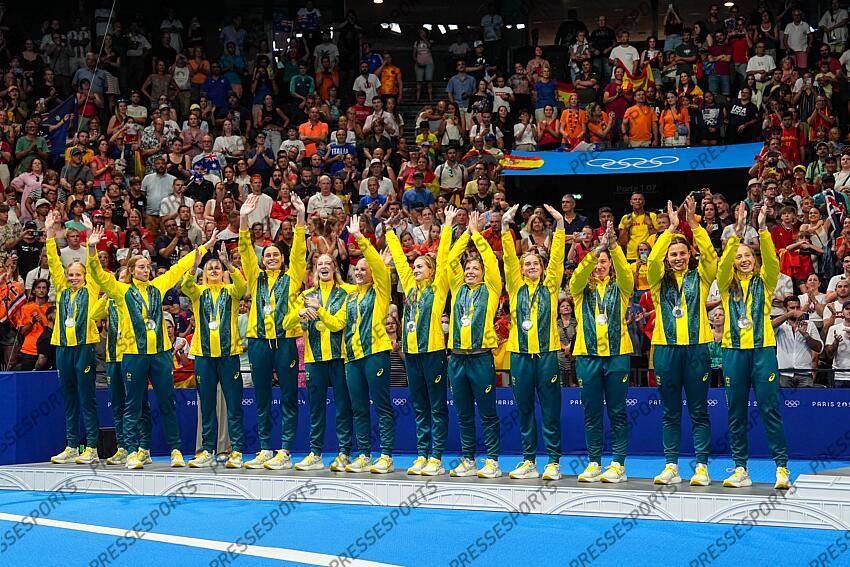 Silver Medalists of Australia celebrate on the podium during the Women’s Water Polo medal ceremony after the Women's Gold Medal match between Australia and Spain at Paris La Defense Arena during the Paris 2024 Olympics Games on August 10, 2024 in Paris, France. AUSTRALIE-ESPAGNE 