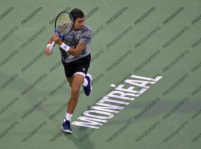 Aug 12, 2024; Montreal, Quebec, Canada; Alexei Popyrin (AUS) hits a forehand against Andrey Rublev (not pictured) during singles final play at IGA Stadium. Mandatory Credit: Eric Bolte-USA TODAY Sports FINALE POPYRIN/RUBLEV 