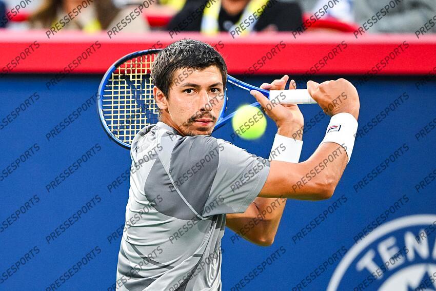 Aug 12, 2024; Montreal, Quebec, Canada; Alexei Popyrin (AUS) returns the ball to Andrey Rublev (not pictured) during singles final play at IGA Stadium. Mandatory Credit: David Kirouac-USA TODAY Sports FINALE POPYRIN/RUBLEV 