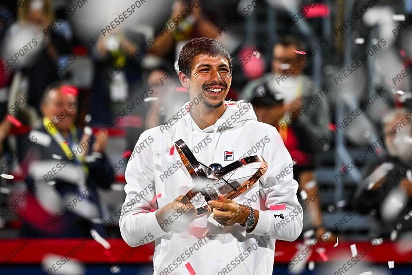 Aug 12, 2024; Montreal, Quebec, Canada; Alexei Popyrin (AUS) winner of the singles final holds his trophy under confettis at IGA Stadium. Mandatory Credit: David Kirouac-USA TODAY Sports FINALE POPYRIN/RUBLEV 
