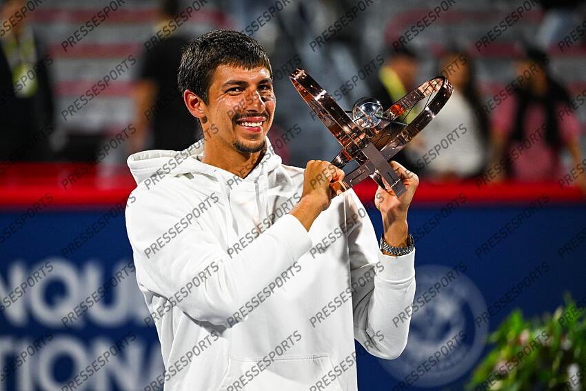 Aug 12, 2024; Montreal, Quebec, Canada; Alexei Popyrin (AUS) winner of the singles final holds his trophy at IGA Stadium. Mandatory Credit: David Kirouac-USA TODAY Sports FINALE POPYRIN/RUBLEV 