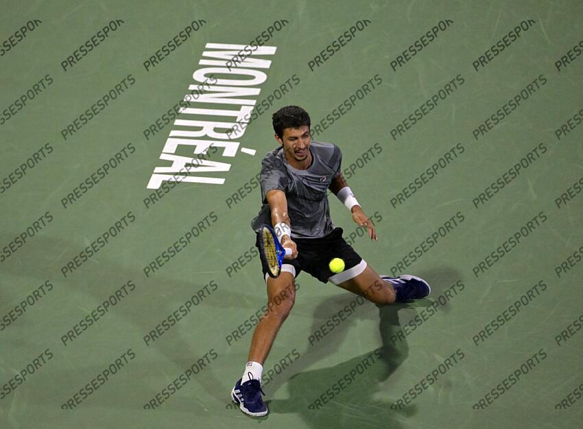 Aug 12, 2024; Montreal, Quebec, Canada; Alexei Popyrin (AUS) hits a forehand against Andrey Rublev (not pictured) during singles final play at IGA Stadium. Mandatory Credit: Eric Bolte-USA TODAY Sports FINALE POPYRIN/RUBLEV 