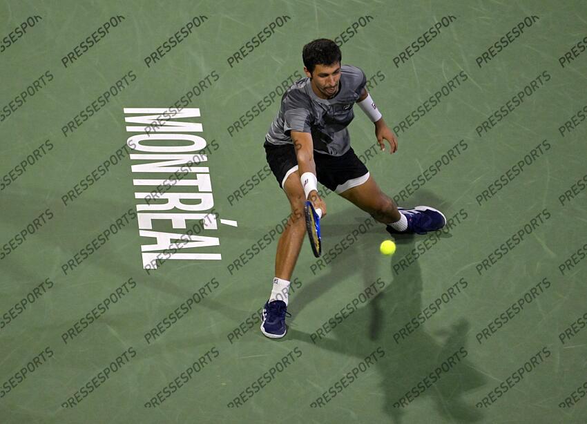 Aug 12, 2024; Montreal, Quebec, Canada; Alexei Popyrin (AUS) hits a forehand against Andrey Rublev (not pictured) during singles final play at IGA Stadium. Mandatory Credit: Eric Bolte-USA TODAY Sports FINALE POPYRIN/RUBLEV 