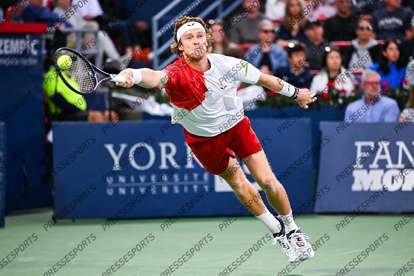Aug 12, 2024; Montreal, Quebec, Canada; Andrey Rublev returns the ball to Alexei Popyrin (AUS) (not pictured) during singles final play at IGA Stadium. Mandatory Credit: David Kirouac-USA TODAY Sports FINALE POPYRIN/RUBLEV 