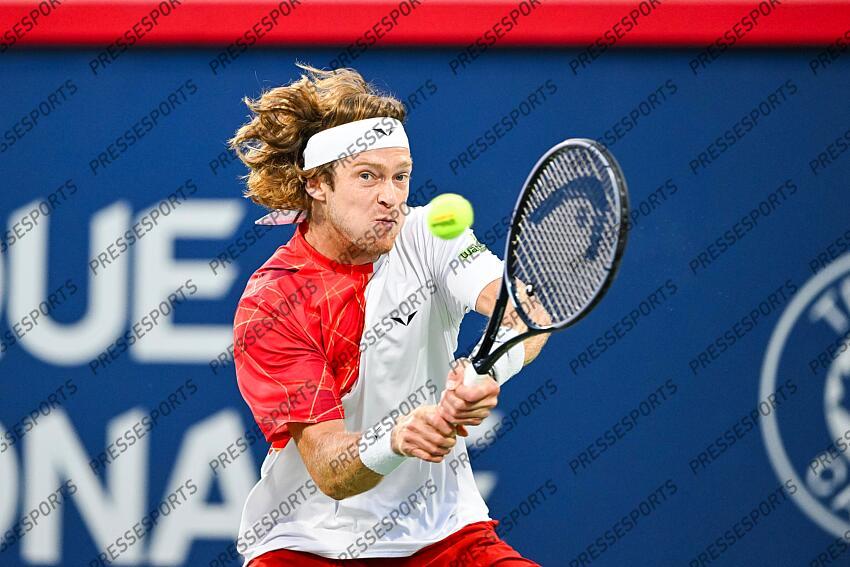 Aug 12, 2024; Montreal, Quebec, Canada; Andrey Rublev returns the ball to Alexei Popyrin (AUS) (not pictured) during singles final play at IGA Stadium. Mandatory Credit: David Kirouac-USA TODAY Sports FINALE POPYRIN/RUBLEV 