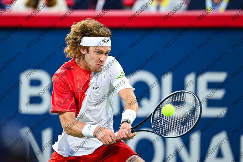 Aug 12, 2024; Montreal, Quebec, Canada; Andrey Rublev returns the ball to Alexei Popyrin (AUS) (not pictured) during singles final play at IGA Stadium. Mandatory Credit: David Kirouac-USA TODAY Sports FINALE POPYRIN/RUBLEV 