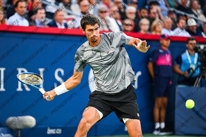 Aug 12, 2024; Montreal, Quebec, Canada; Alexei Popyrin (AUS) returns the ball to Andrey Rublev (not pictured) during singles final play at IGA Stadium. Mandatory Credit: David Kirouac-USA TODAY Sports FINALE POPYRIN/RUBLEV 