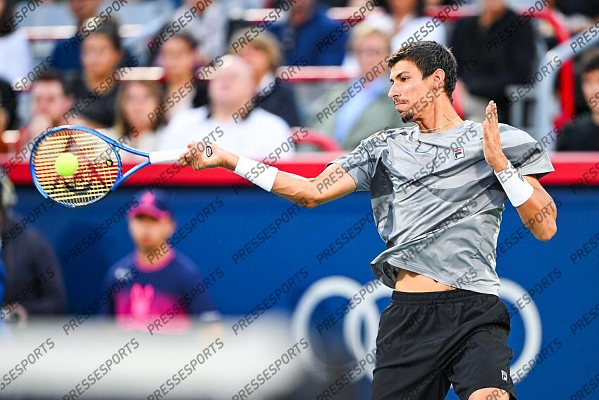 Aug 12, 2024; Montreal, Quebec, Canada; Alexei Popyrin (AUS) returns the ball to Andrey Rublev (not pictured) during singles final play at IGA Stadium. Mandatory Credit: David Kirouac-USA TODAY Sports FINALE POPYRIN/RUBLEV 