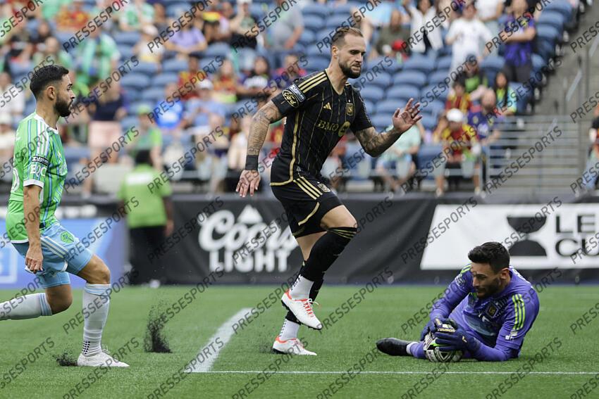 Aug 17, 2024; Seattle, Washington, USA; Los Angeles FC goalkeeper Hugo Lloris (1) stops a shot by Seattle Sounders midfielder Alex Roldan (16) while Los Angeles FC midfielder Ryan Hollingshead (24) looks on in a Leagues Cup quarterfinal match at Lumen Field. Mandatory Credit: John Froschauer-USA TODAY Sports MLS: Leagues Cup-Quarterfinals-LAFC at Seattle Sounders FC 