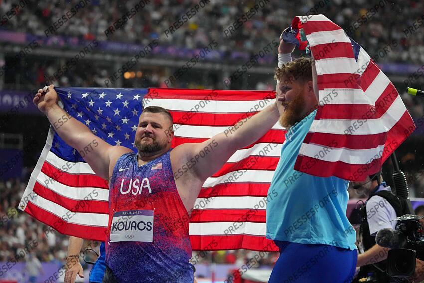 Aug 3, 2024; Paris, FRANCE; Joe Kovacs (USA) and Ryan Crouser (USA) celebrate after the men's shot put final during the Paris 2024 Olympic Summer Games at Stade de France. Mandatory Credit: Kirby Lee-USA TODAY Sports LANCER DU POIDS HOMMES 