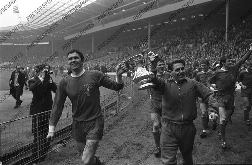 01 May 1965 FA Cup Final Leeds United v Liverpool; the injured Gordon Milne parades the trophy with Liverpool skipper Ron Yeats (left). Photo: Gerry Cranham. FA Cup Final 1965 