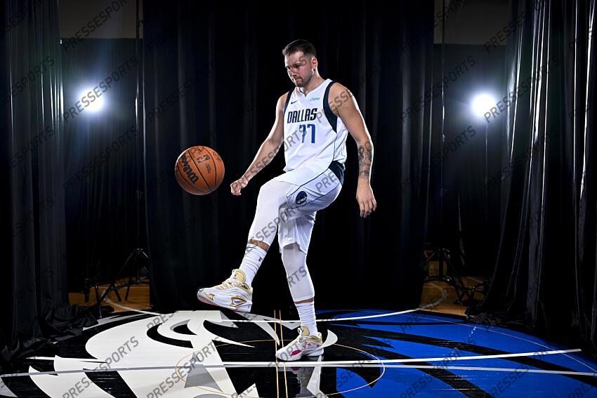 Sep 30, 2024; Dallas, TX, USA; Dallas Mavericks guard Luka Doncic (77) dribbles the basketball in soccer style as he poses for a photo during the 2024 Dallas Mavericks media day. Mandatory Credit: Jerome Miron-Imagn Images Dallas Mavericks-Media Day 
