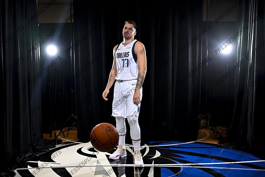Sep 30, 2024; Dallas, TX, USA; Dallas Mavericks guard Luka Doncic (77) dribbles the basketball in soccer style as he poses for a photo during the 2024 Dallas Mavericks media day. Mandatory Credit: Jerome Miron-Imagn Images Dallas Mavericks-Media Day 