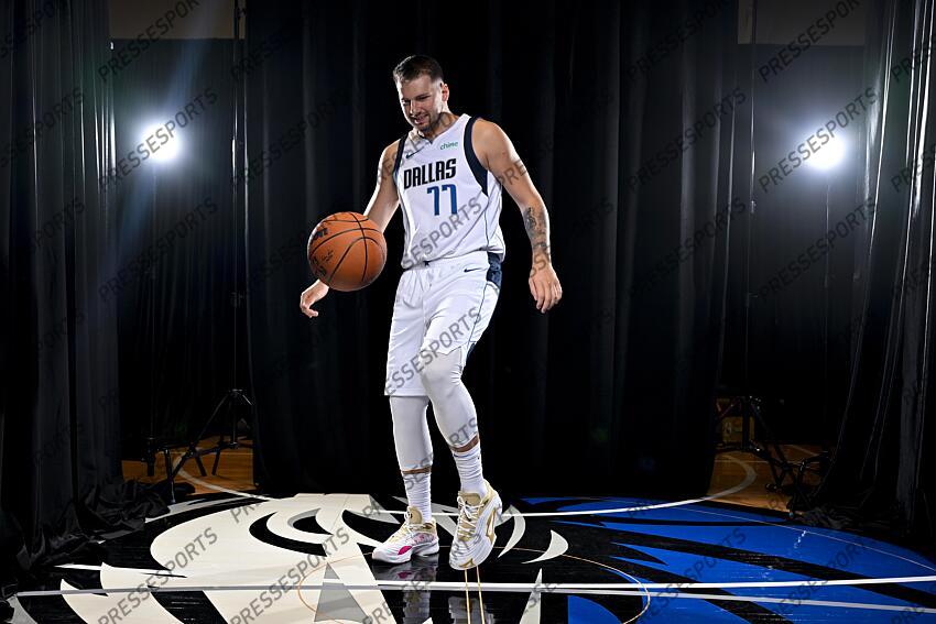 Sep 30, 2024; Dallas, TX, USA; Dallas Mavericks guard Luka Doncic (77) dribbles the basketball in soccer style as he poses for a photo during the 2024 Dallas Mavericks media day. Mandatory Credit: Jerome Miron-Imagn Images Dallas Mavericks-Media Day 