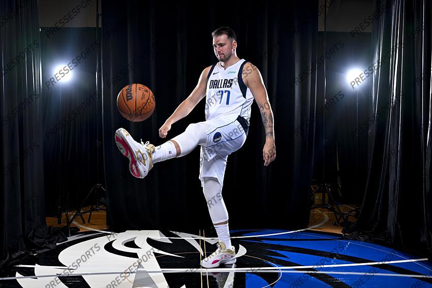 Sep 30, 2024; Dallas, TX, USA; Dallas Mavericks guard Luka Doncic (77) dribbles the basketball in soccer style as he poses for a photo during the 2024 Dallas Mavericks media day. Mandatory Credit: Jerome Miron-Imagn Images Dallas Mavericks-Media Day 