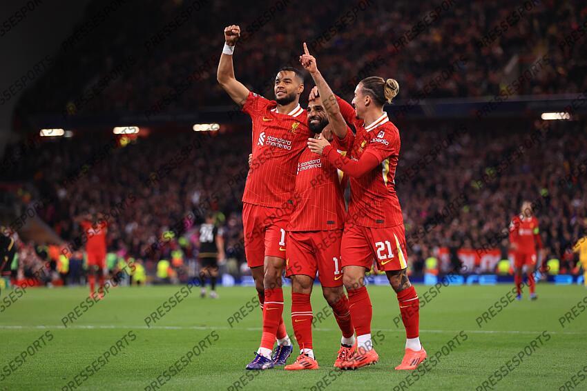 2nd October 2024 - UEFA Champions League - Liverpool FC v Bologna FC - Cody Gakpo and Mohamed Salah of Liverpool celebrates the second goal with Kostas Tsimikas - Photo: Simon Stacpoole / Offside. LIVERPOOL-BOLOGNE (2-0) 