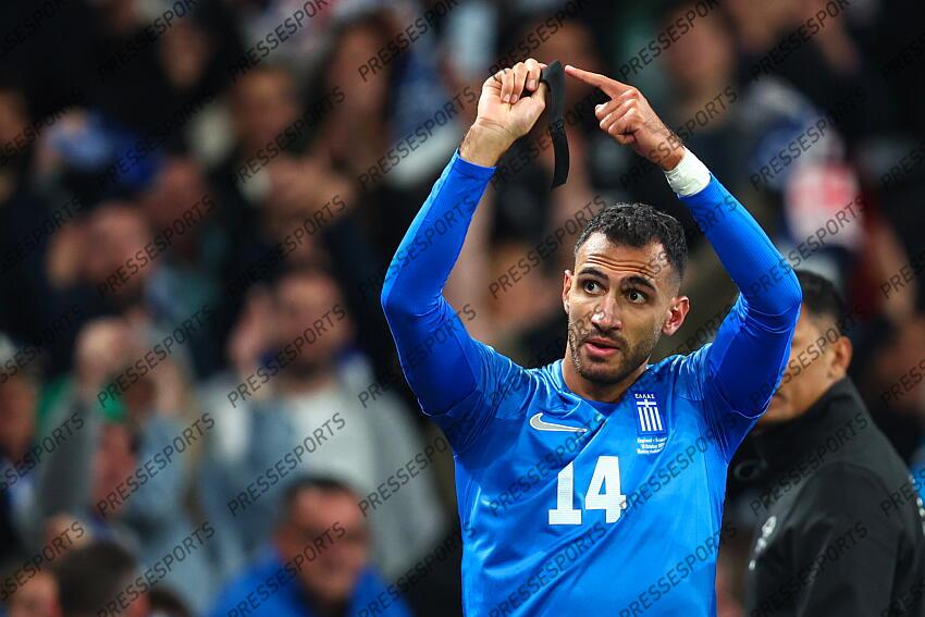 10 October 2024, London - International Football, UEFA Nation’s League - England v Greece - Vangelis Pavlidis of Greece celebrates scoring the opening goal by pointing to his black armband, worn in memory of teammate George Baldock - Photo: Charlotte Wilson / Offside. ANGLETERRE-GRECE (1-2) 