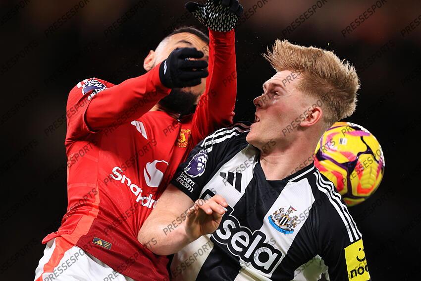 30th December 2024 - Premier League - Manchester United v Newcastle United - Lewis Hall of Newcastle United gets an arm in the face from Noussair Mazraoui of Manchester United - Photo: Simon Stacpoole / Offside. MANCHESTER UNITED-NEWCASTLE UNITED (0-2) 