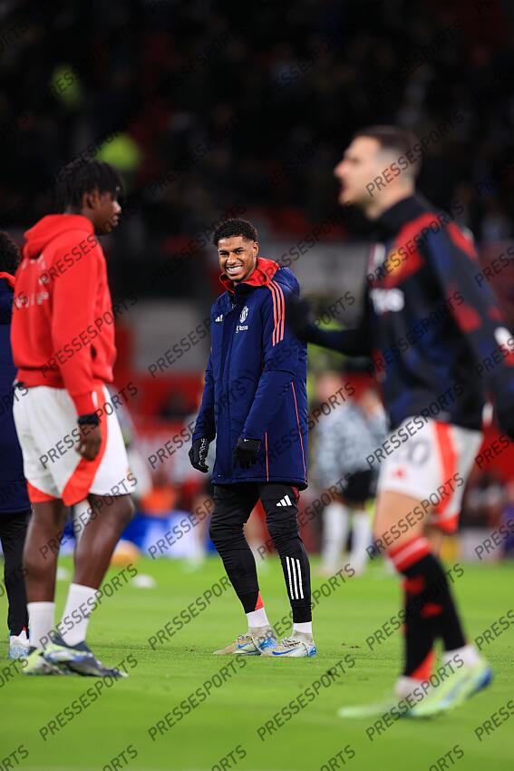 30th December 2024 - Premier League - Manchester United v Newcastle United - Marcus Rashford of Manchester United laughs and smiles as he warms up - Photo: Simon Stacpoole / Offside. MANCHESTER UNITED-NEWCASTLE UNITED (0-2) 