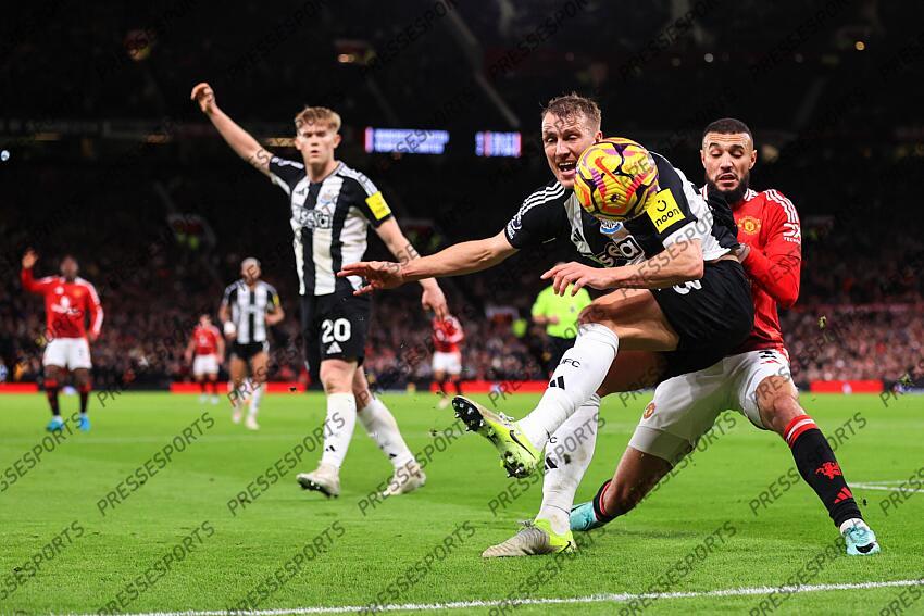 30th December 2024 - Premier League - Manchester United v Newcastle United - Noussair Mazraoui of Manchester United and Dan Burn of Newcastle United - Photo: Simon Stacpoole / Offside. MANCHESTER UNITED-NEWCASTLE UNITED (0-2) 