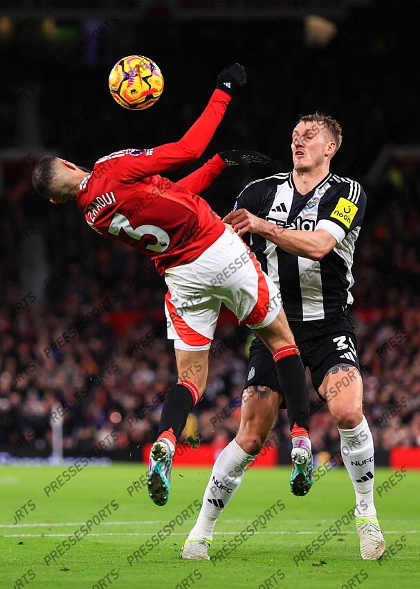 30th December 2024 - Premier League - Manchester United v Newcastle United - Noussair Mazraoui of Manchester United and Dan Burn of Newcastle United - Photo: Simon Stacpoole / Offside. MANCHESTER UNITED-NEWCASTLE UNITED (0-2) 