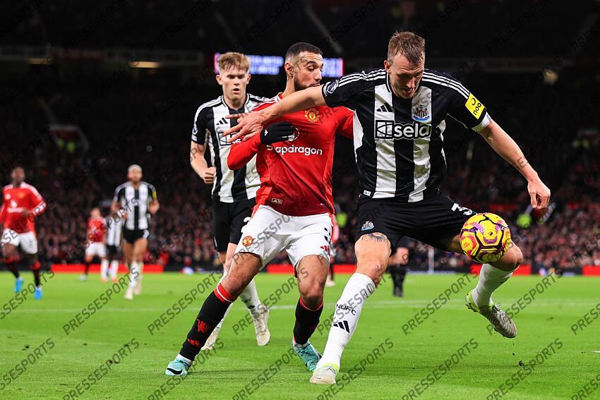 30th December 2024 - Premier League - Manchester United v Newcastle United - Noussair Mazraoui of Manchester United and Dan Burn of Newcastle United - Photo: Simon Stacpoole / Offside. MANCHESTER UNITED-NEWCASTLE UNITED (0-2) 