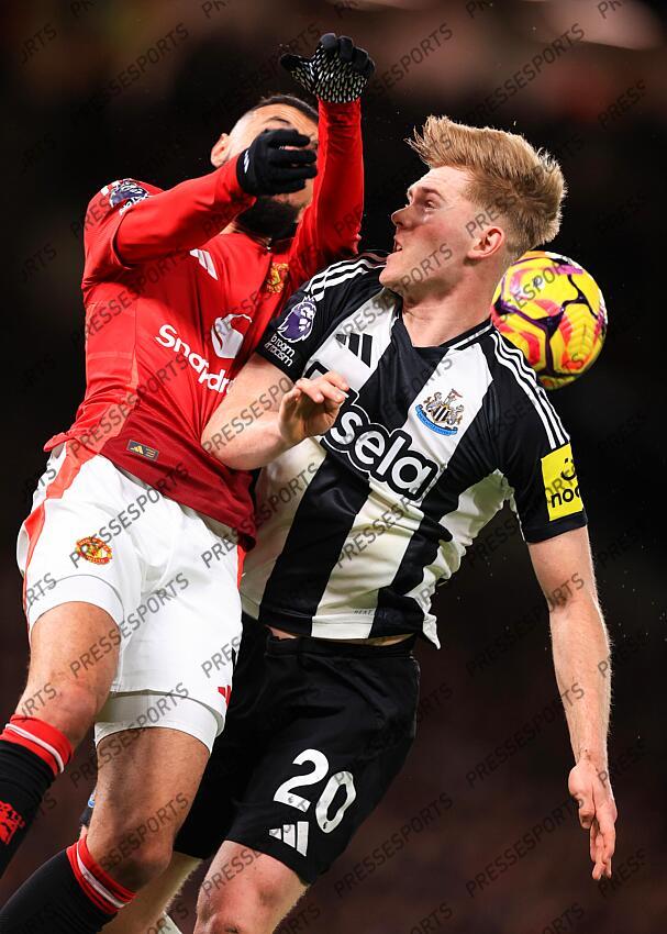 30th December 2024 - Premier League - Manchester United v Newcastle United - Noussair Mazraoui of Manchester United and Lewis Hall of Newcastle United - Photo: Simon Stacpoole / Offside. MANCHESTER UNITED-NEWCASTLE UNITED (0-2) 