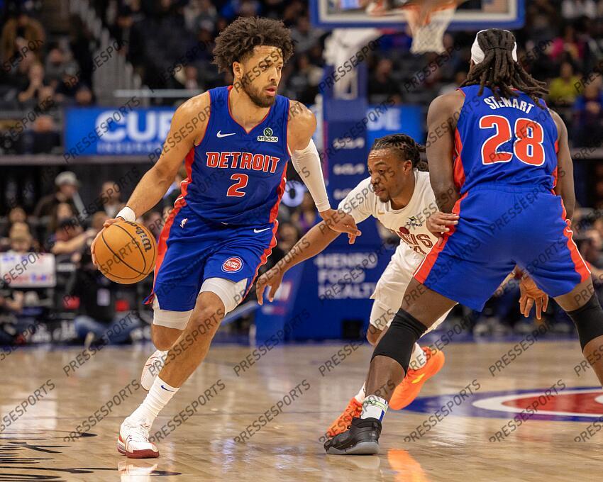 Feb 5, 2025; Detroit, Michigan, USA; Detroit Pistons guard Cade Cunningham (2) moves the ball up court as center Isaiah Stewart (28) sets a pick on Cleveland Cavaliers guard Darius Garland (10) during the first half at Little Caesars Arena. Mandatory Credit: David Reginek-Imagn Images NBA: Cleveland Cavaliers at Detroit Pistons 