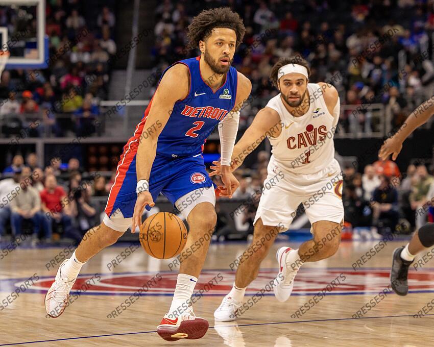 Feb 5, 2025; Detroit, Michigan, USA; Detroit Pistons guard Cade Cunningham (2) moves the ball up court next to Cleveland Cavaliers guard Max Strus (1) during the first half at Little Caesars Arena. Mandatory Credit: David Reginek-Imagn Images NBA: Cleveland Cavaliers at Detroit Pistons 