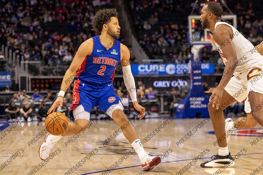 Feb 5, 2025; Detroit, Michigan, USA; Detroit Pistons guard Cade Cunningham (2) moves the ball up court on Cleveland Cavaliers forward Evan Mobley (4) during the first half at Little Caesars Arena. Mandatory Credit: David Reginek-Imagn Images NBA: Cleveland Cavaliers at Detroit Pistons 