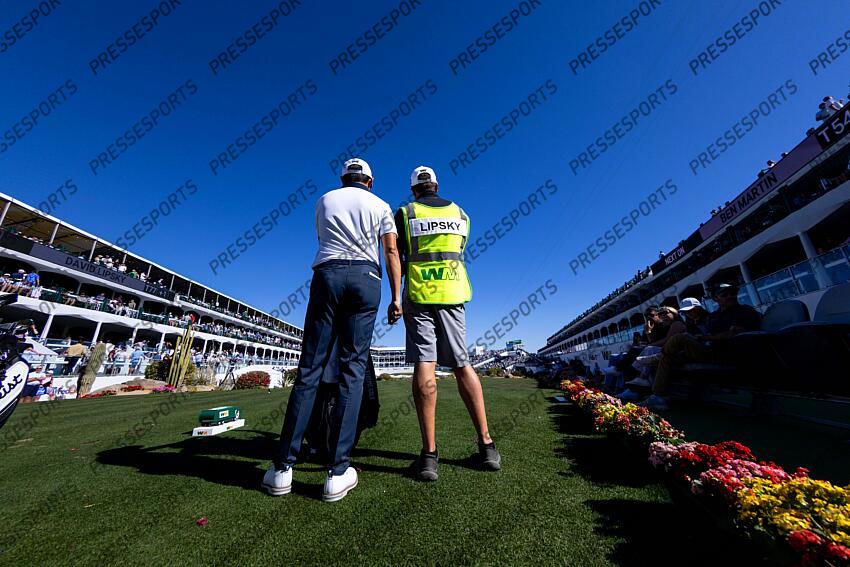 Feb 6, 2025; Scottsdale, Arizona, USA; David Lipsky and his caddie talk before the tee off at hole 16 during the first round of the WM Phoenix Open golf tournament. Mandatory Credit: Aryanna Frank-Imagn Images PGA: WM Phoenix Open - First Round 