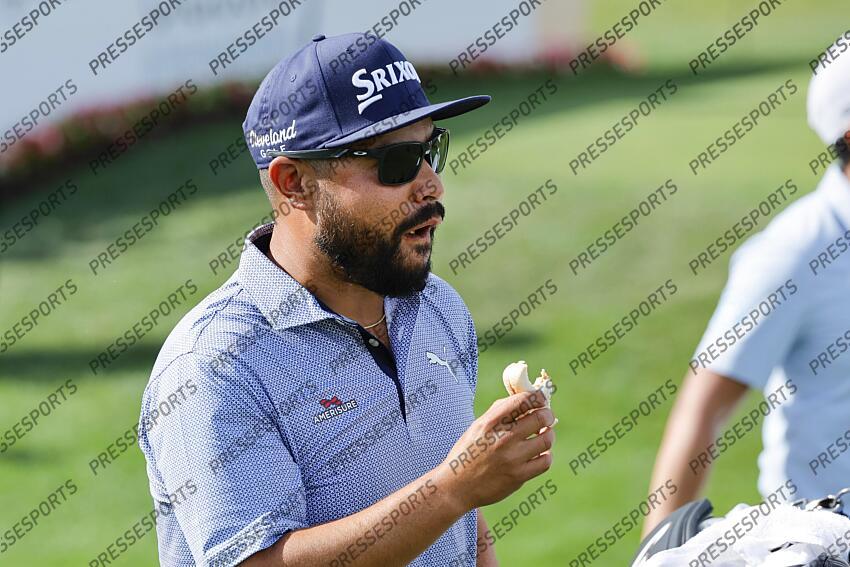 Feb 27, 2025; Palm Beach Gardens, Florida, USA; J.J. Spaun eats a snack as he walks off of the ninth tee box during the first round of the Cognizant Classic in The Palm Beaches golf tournament. Mandatory Credit: Reinhold Matay-Imagn Images PGA: Cognizant Classic in The Palm Beaches - First Round 
