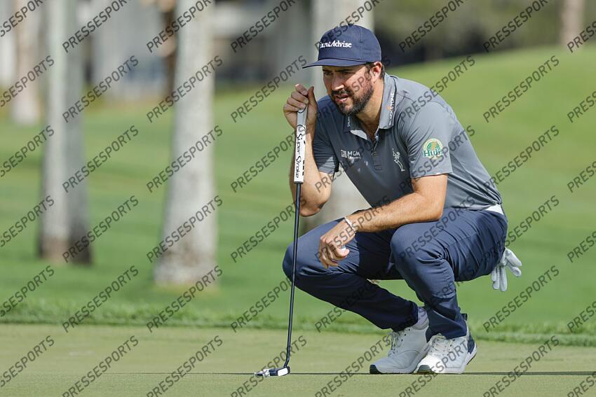 Feb 27, 2025; Palm Beach Gardens, Florida, USA; Mark Hubbard lines up his putt on the third green during the first round of the Cognizant Classic in The Palm Beaches golf tournament. Mandatory Credit: Reinhold Matay-Imagn Images PGA: Cognizant Classic in The Palm Beaches - First Round 