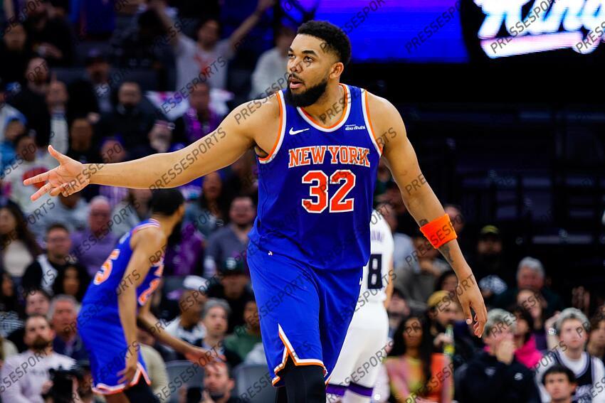 Mar 10, 2025; Sacramento, California, USA; New York Knicks center Karl-Anthony Towns (32) celebrates after a basket against the Sacramento Kings during the fourth quarter at Golden 1 Center. Mandatory Credit: Sergio Estrada-Imagn Images NBA: New York Knicks at Sacramento Kings 