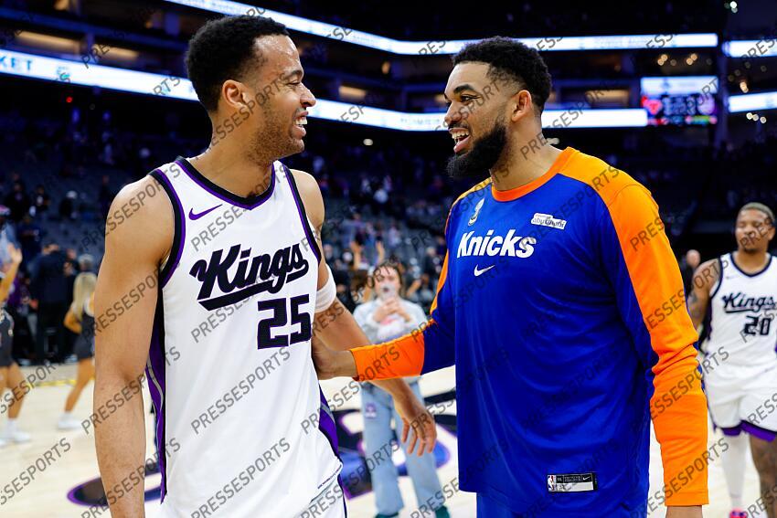 Mar 10, 2025; Sacramento, California, USA; New York Knicks center Karl-Anthony Towns (32) talks with Sacramento Kings center Skal Labissiere (25) after the game at Golden 1 Center. Mandatory Credit: Sergio Estrada-Imagn Images NBA: New York Knicks at Sacramento Kings 