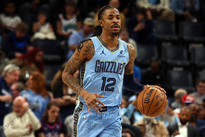 Mar 10, 2025; Memphis, Tennessee, USA; Memphis Grizzlies guard Ja Morant (12) dribbles up the court during the first quarter against the Phoenix Suns at FedExForum. Mandatory Credit: Petre Thomas-Imagn Images NBA: Phoenix Suns at Memphis Grizzlies 