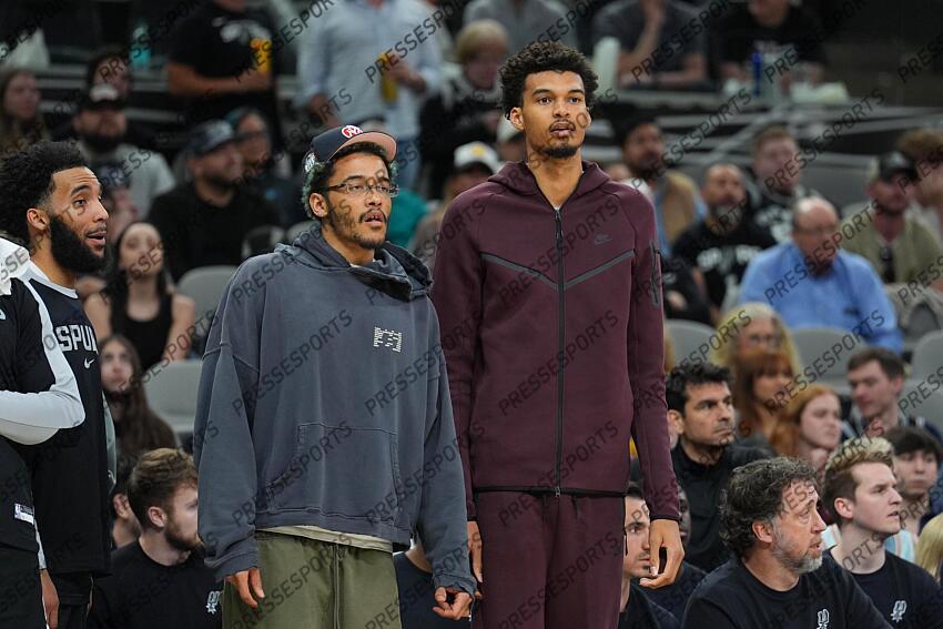 Mar 10, 2025; San Antonio, Texas, USA; San Antonio Spurs forward Jeremy Sochan (10) and center Victor Wembanyama (1) look on in the second half against the Dallas Mavericks at Frost Bank Center. Mandatory Credit: Daniel Dunn-Imagn Images NBA: Dallas Mavericks at San Antonio Spurs 