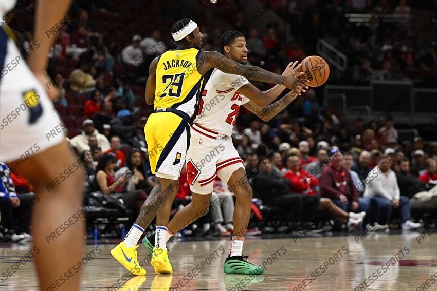 Mar 10, 2025; Chicago, Illinois, USA; Chicago Bulls forward Dalen Terry (25) passes the ball away from Indiana Pacers guard Quenton Jackson (29) during the second half at United Center. Mandatory Credit: Matt Marton-Imagn Images NBA: Indiana Pacers at Chicago Bulls 